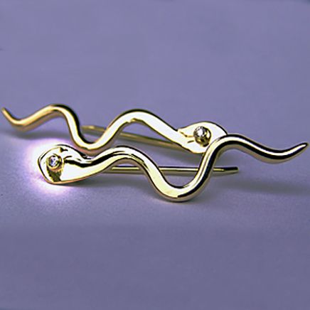Handcrafted gold earrings set with diamonds